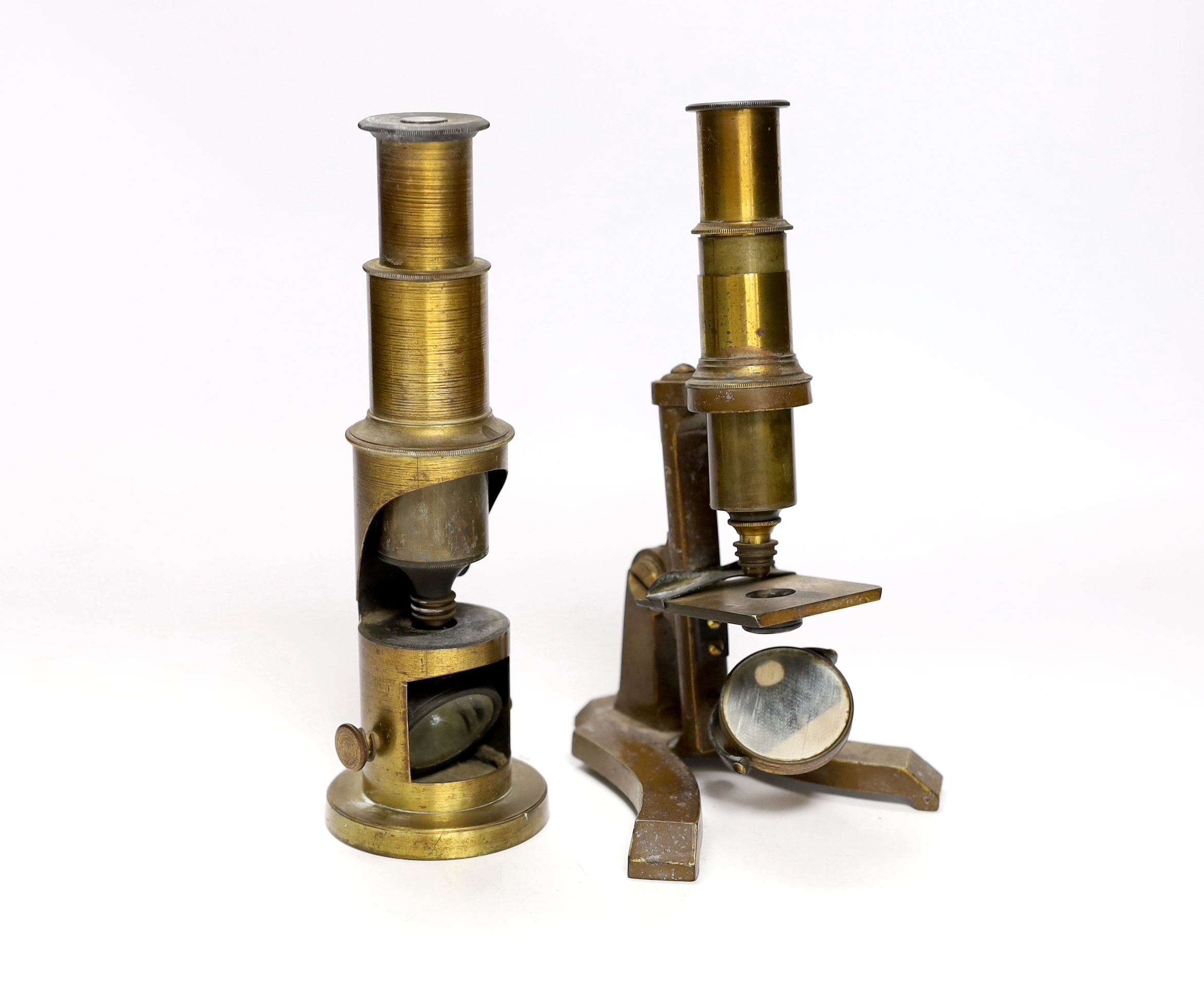 Two 19th century microscopes; a student’s field microscope together with another on a brass stand, 20cm